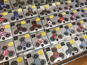  a pile of boxes containing fidget spinners