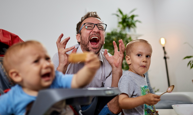 a frustrated new dad screaming