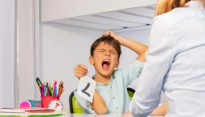 autistic boy having a meltdown in front of his teacher