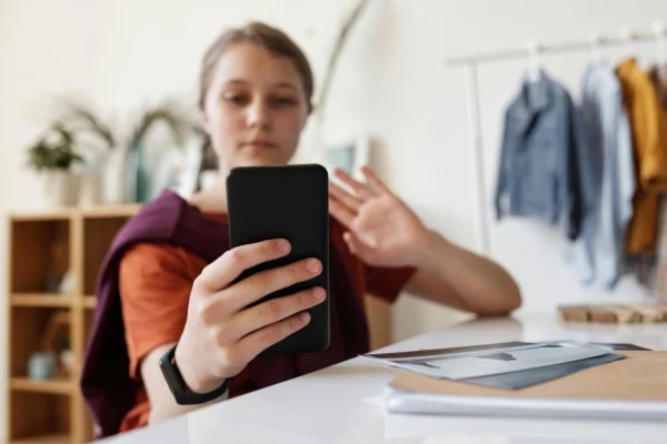 Child using phone for digital time management