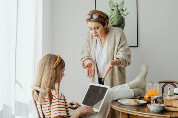 Mother telling child the rules at home.