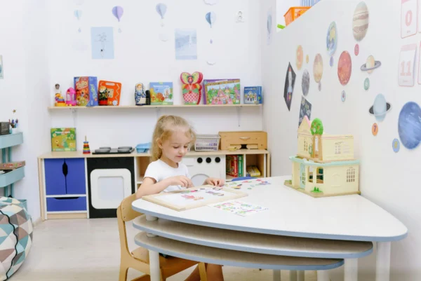 A child seating comfortably in a calm-down corner