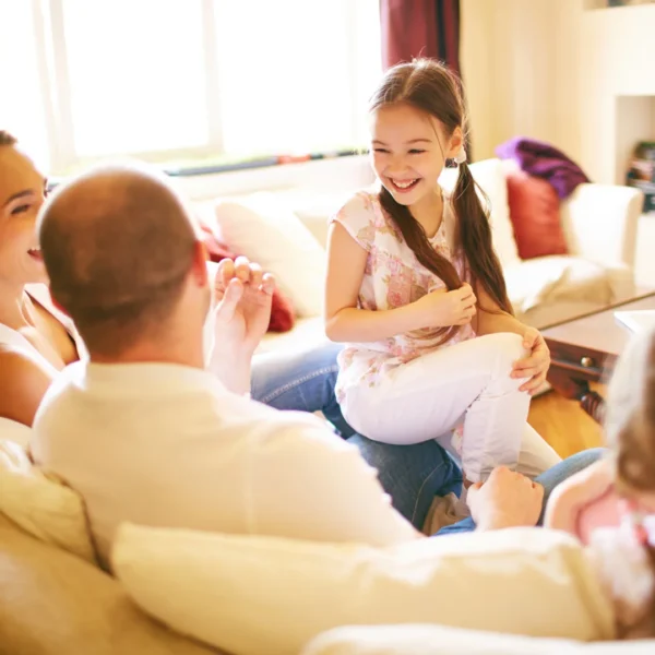 a happy family gathered in the living room