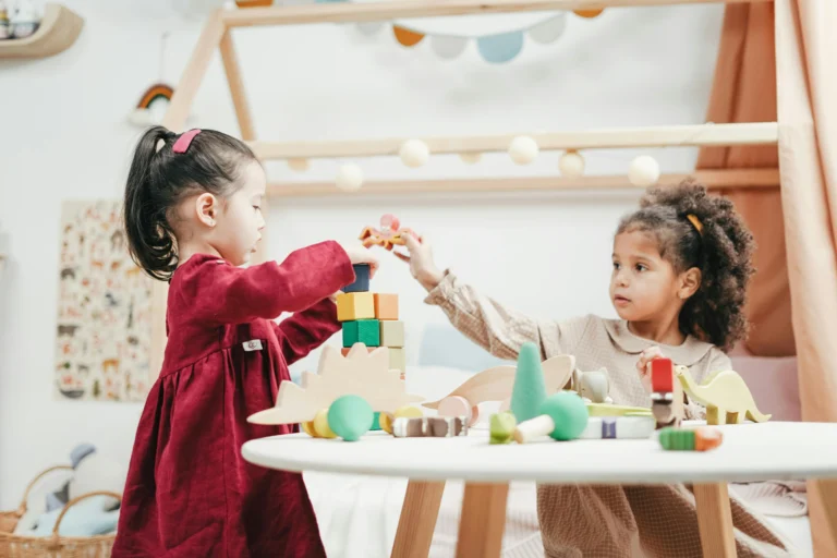 Toddlers playing age appropriate toys