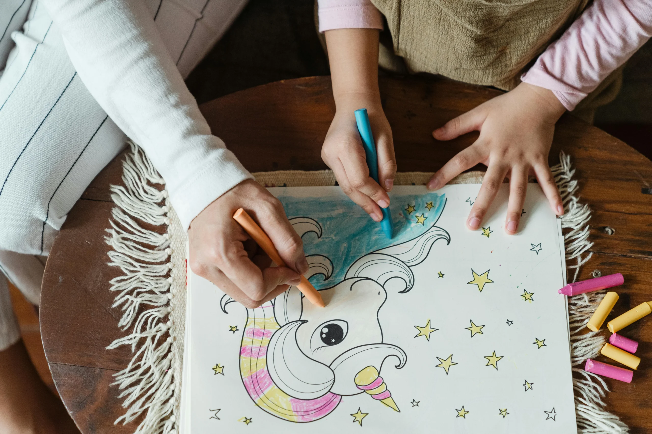 School age child playing with coloring pens